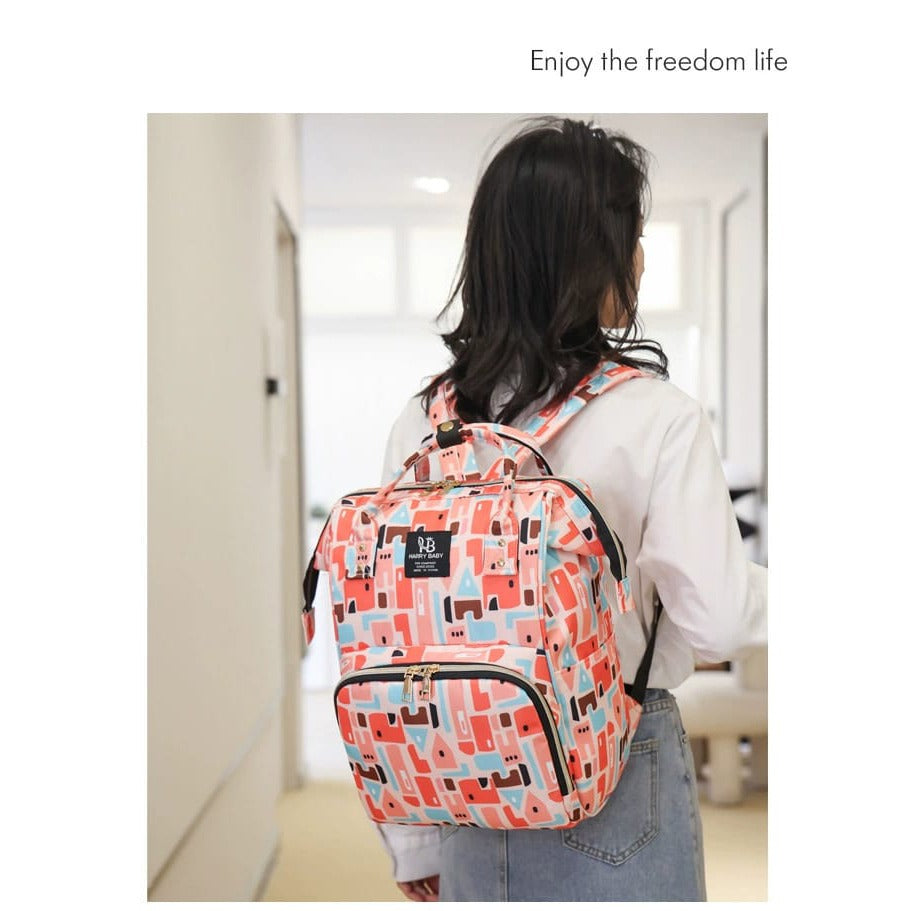 A woman carrying City Red color Mother Backpack Bag on her shoulder