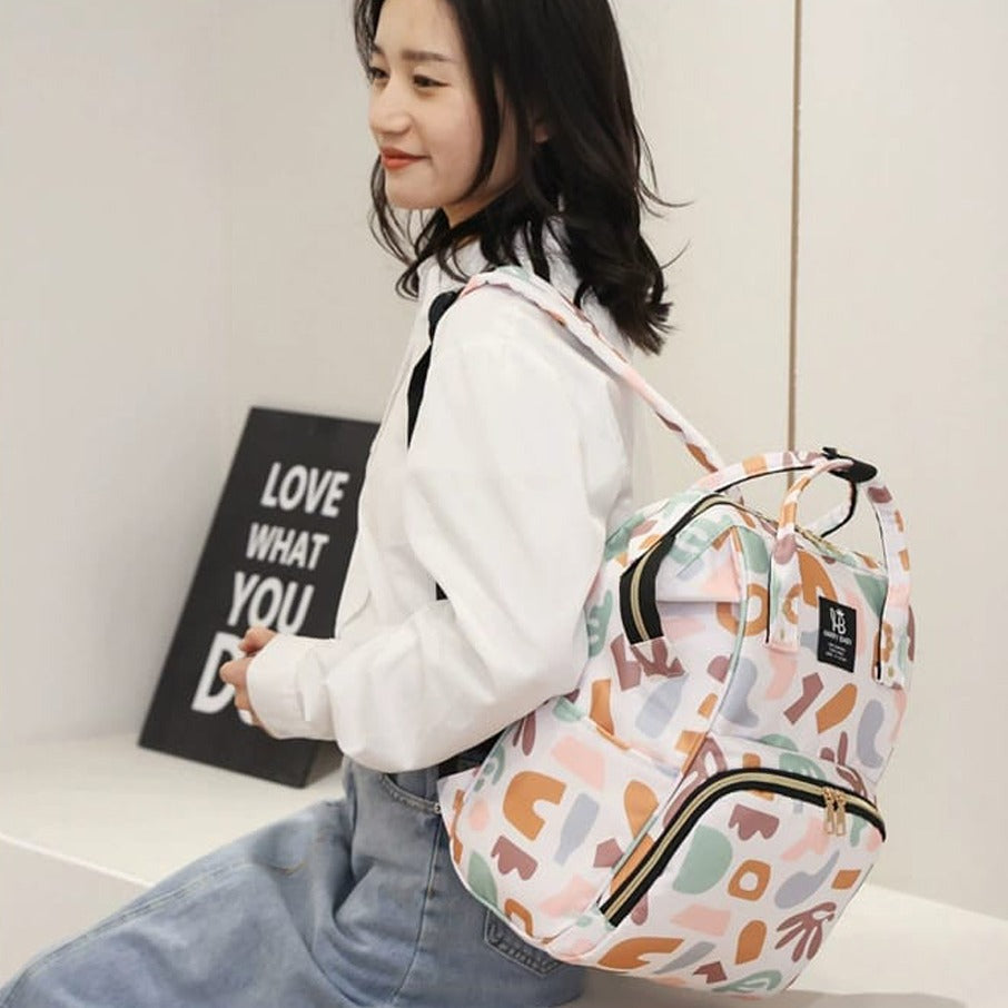 A woman carrying Mother Backpack Bag
