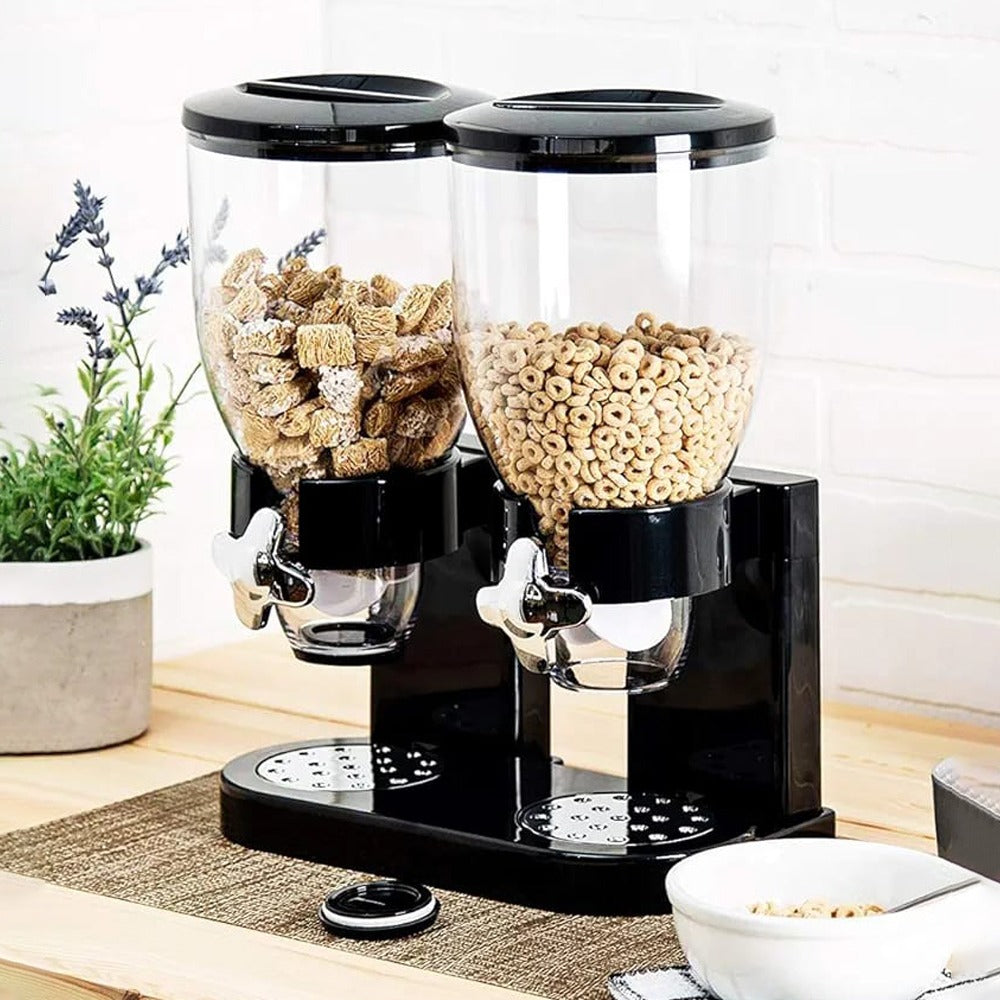 Black color Snack and Cereal Dispenser with snacks filled in it placed near to a plant pot