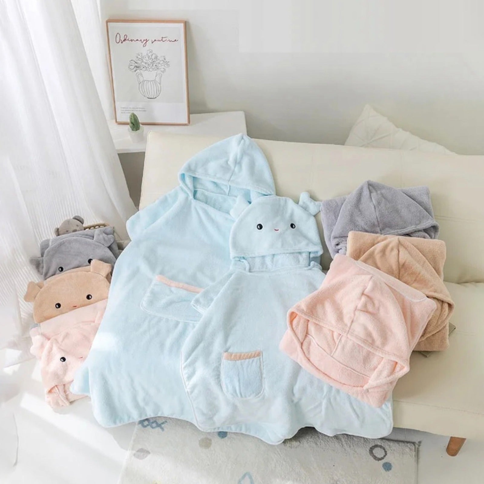 Couple of Quick-Drying Hooded Bathrobe kept in a bed