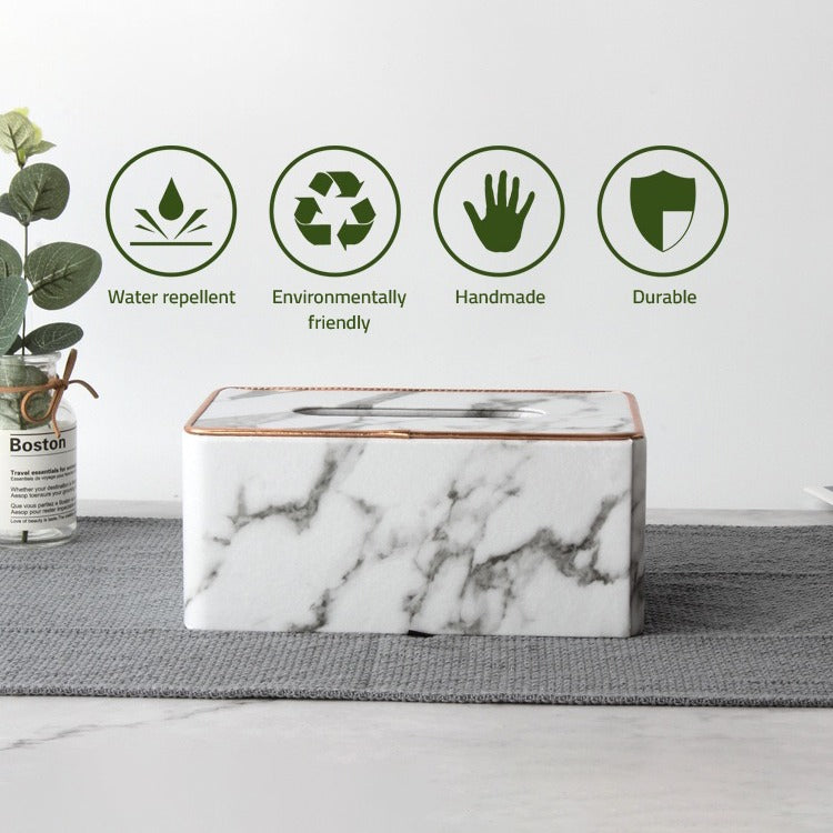 Rectangular Tissue Box Holder, placed on a sheet next to a vase of flowers, showcasing its various features