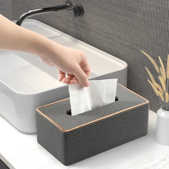 Someone taking tissue from the Rectangular Tissue Box Holder