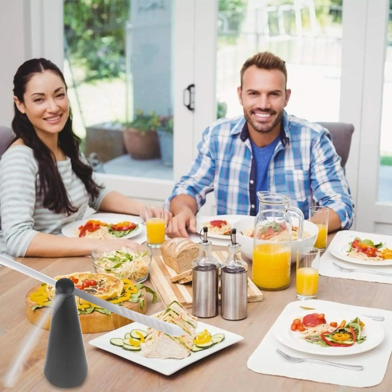 family enjoying their meal with Fan Fly Repellent on top of their table