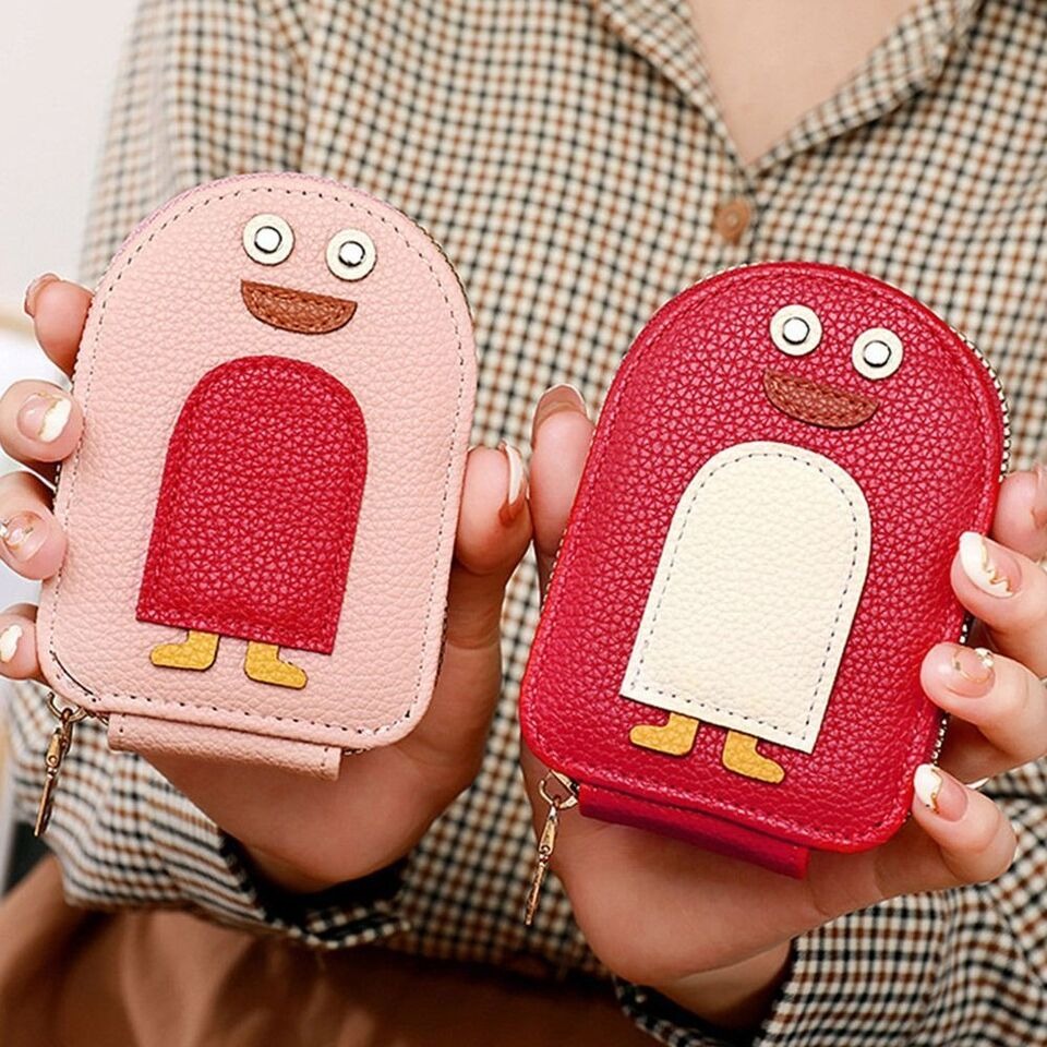 lady holding 2 Cute Penguin Credit Card Coin Wallet