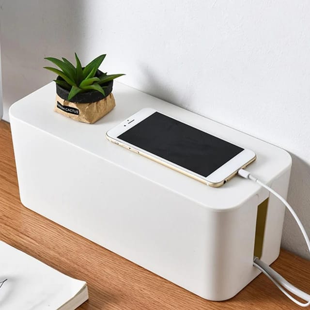 A Phone is Charging By Placing Charger on Extension Socket Storage Box.