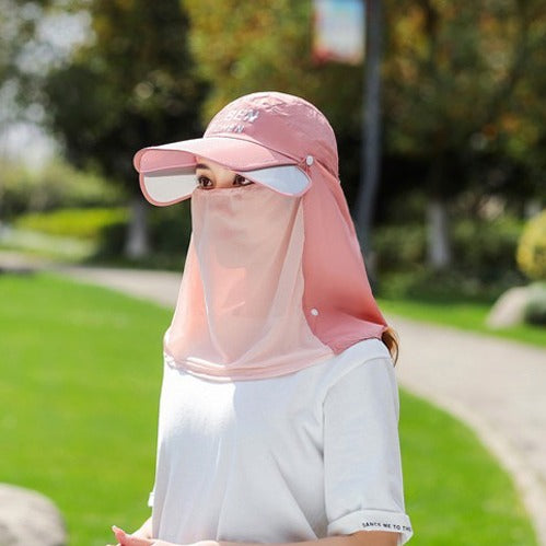 A Woman is Wearing Wide Brim Bucket Hat with Neck Cover.