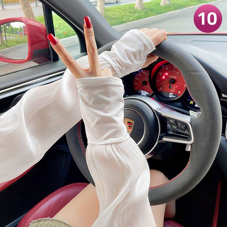 A Women is Wearing Women Summer Arm Sleeves While Driving.