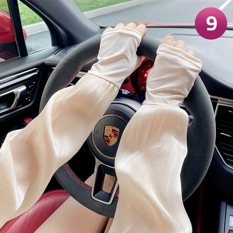 A Women is Wearing Women Summer Arm Sleeves While Driving.