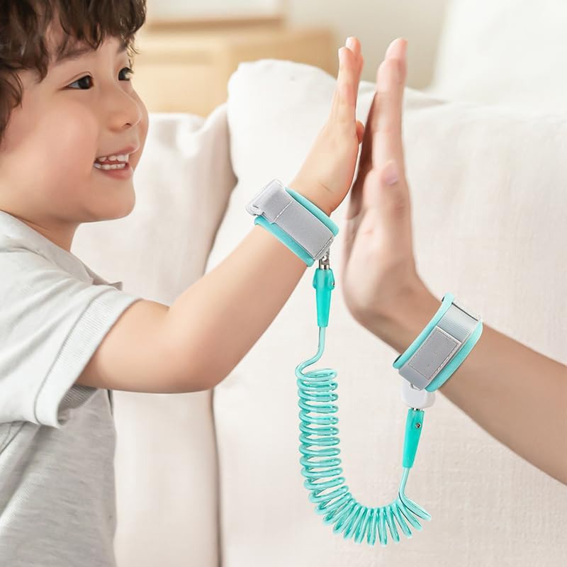 A young child and an adult are connected using an anti-lost wrist link, designed to keep the child safely close.