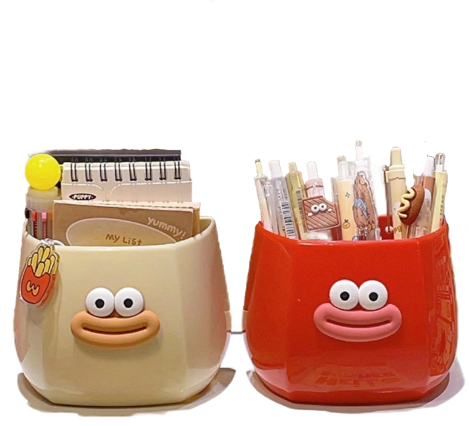 Two cute cartoon-style desk organizers with smiling faces, used to hold pens, stationery, and small items, adding a fun and playful touch to any workspace.