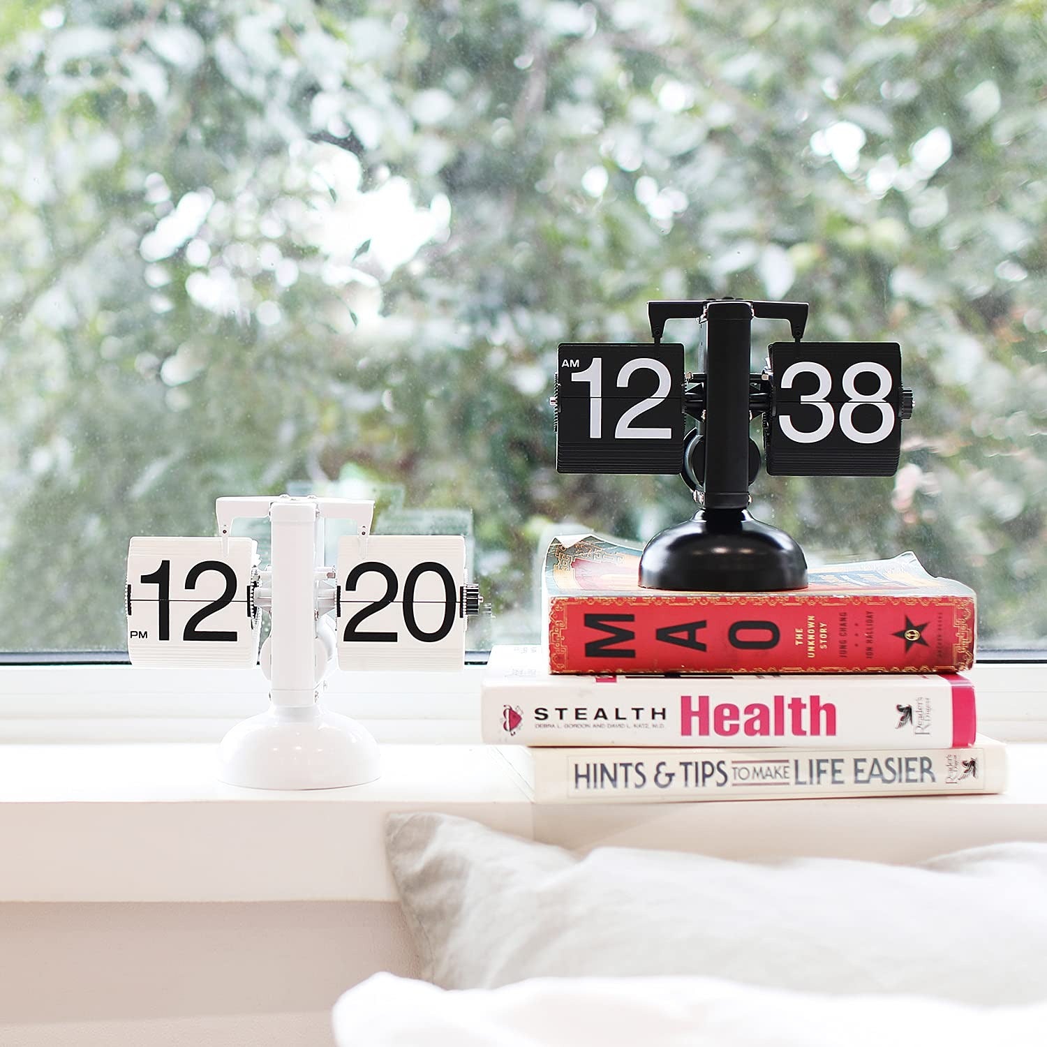 a white and a black Flip Clock on bedroom