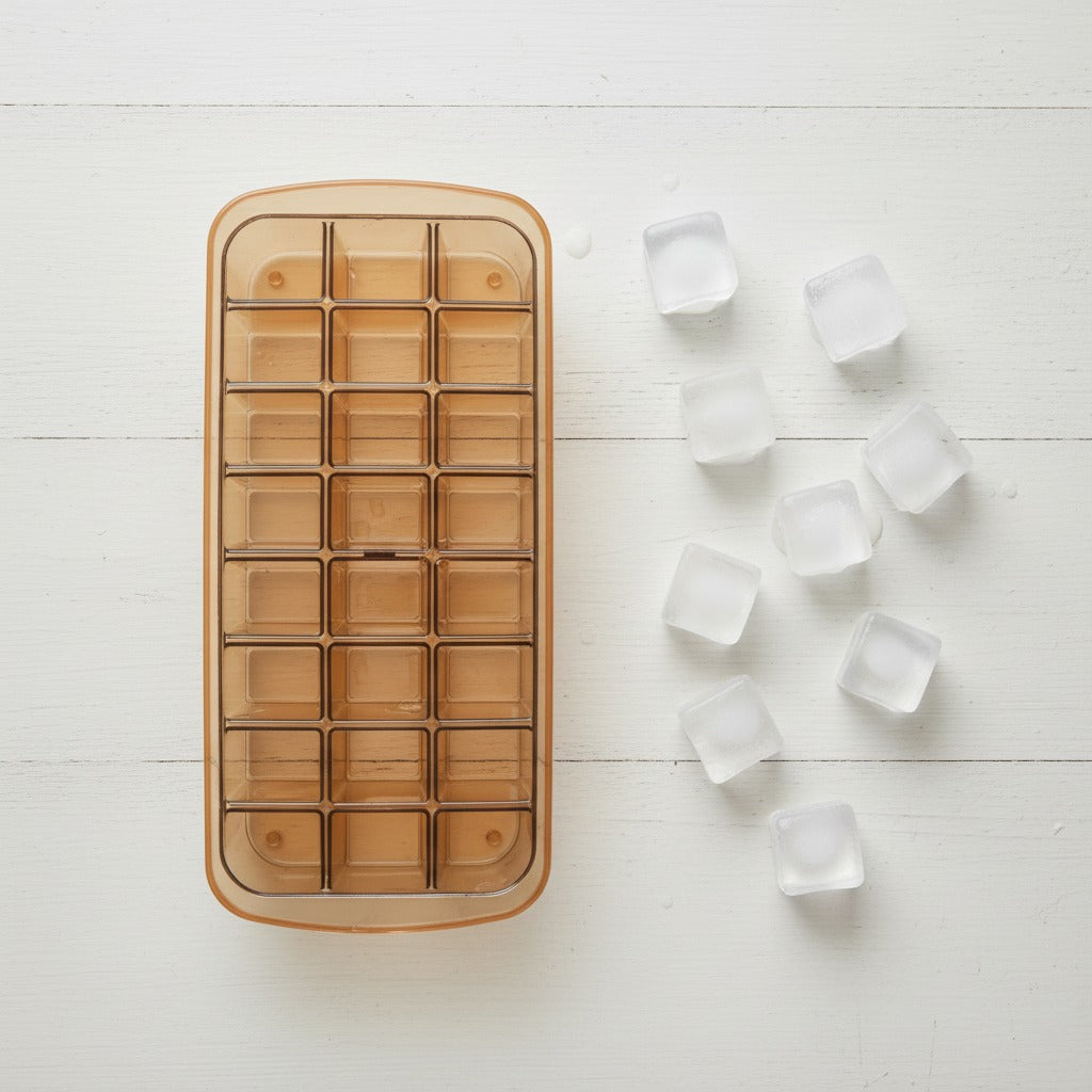 ice cube tray with frozen cubes on a white surface