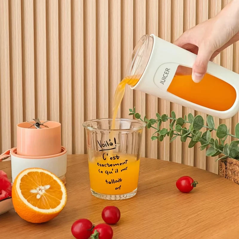 A compact portable juicer pouring fresh orange juice into a glass, placed on a kitchen counter with sliced fruits, showcasing easy and convenient juice preparation.