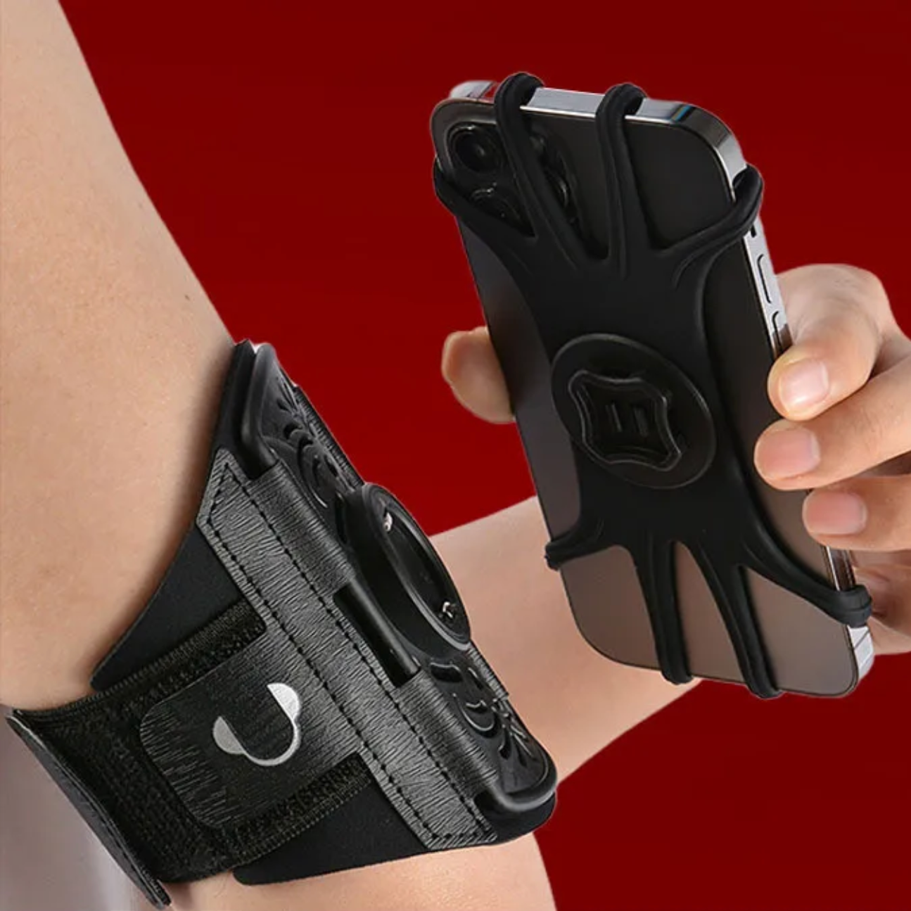 A person is wearing a sports armband phone holder on their upper arm while detaching the phone from the mount