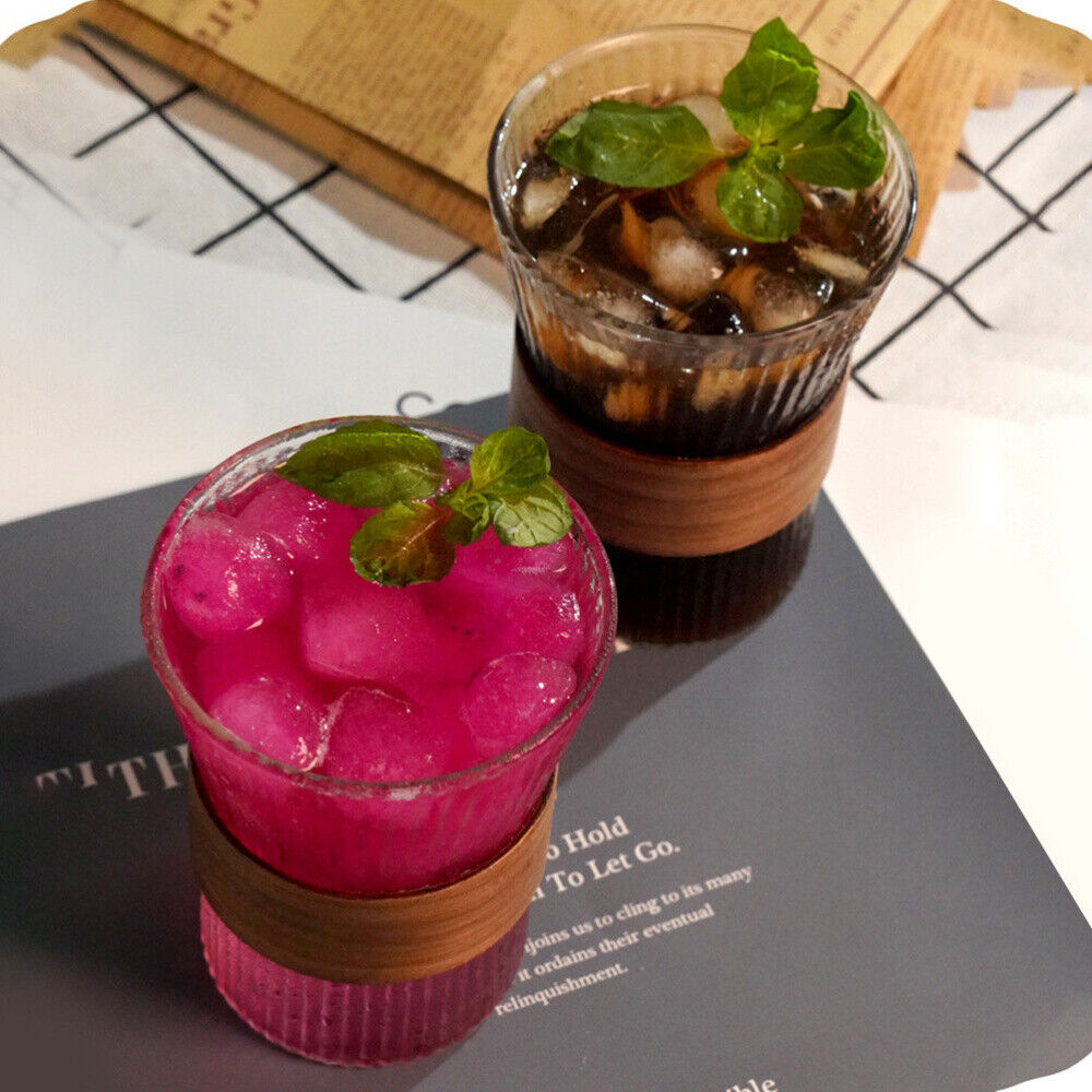 Wide Mouth Glass Coffee Mug with liquid, ice, and mint leaves