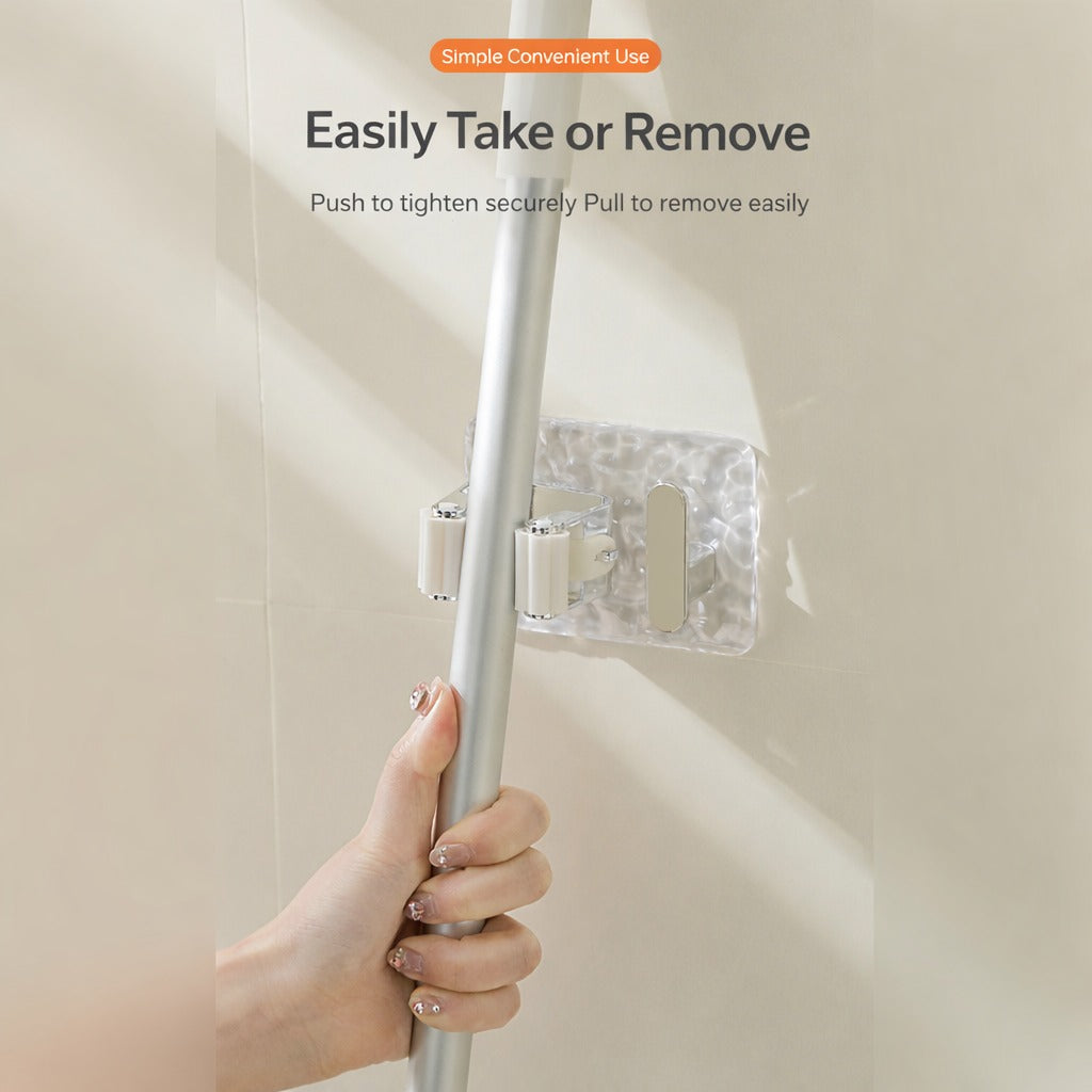 A person is taking Mop from wall-mounted mop and broom holder.