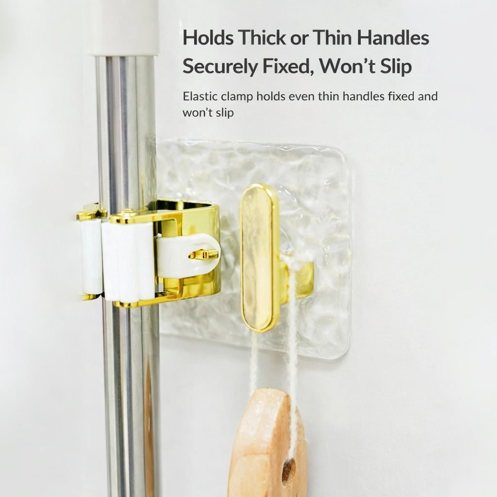 A wall-mounted mop and broom holder with a roller clamp design, featuring strong adhesive backing and an extra hook for hanging accessories, ensuring a secure, non-slip grip without damaging surfaces.