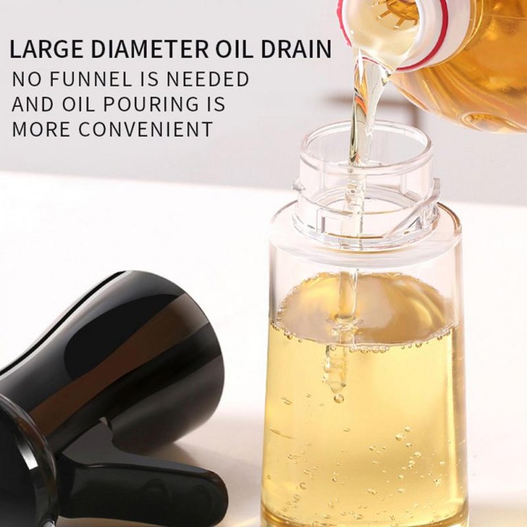 Someone is pouring oil into the 200ml Kitchen Cooking Salad BBQ Oil Sprayer without using a funnel