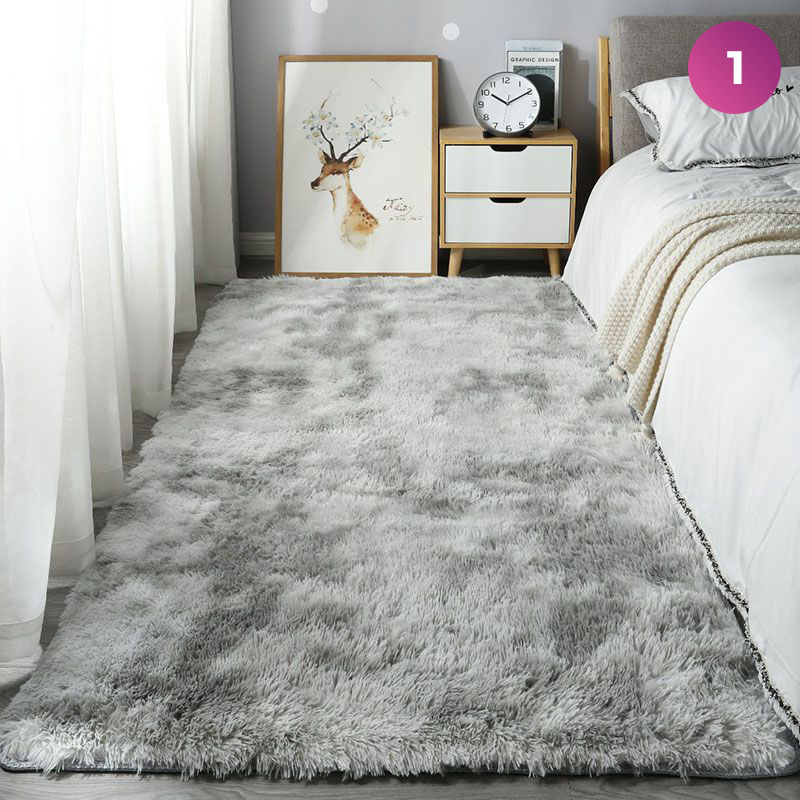 An Ultra Soft Indoor Rug is placed in a room next to the bed