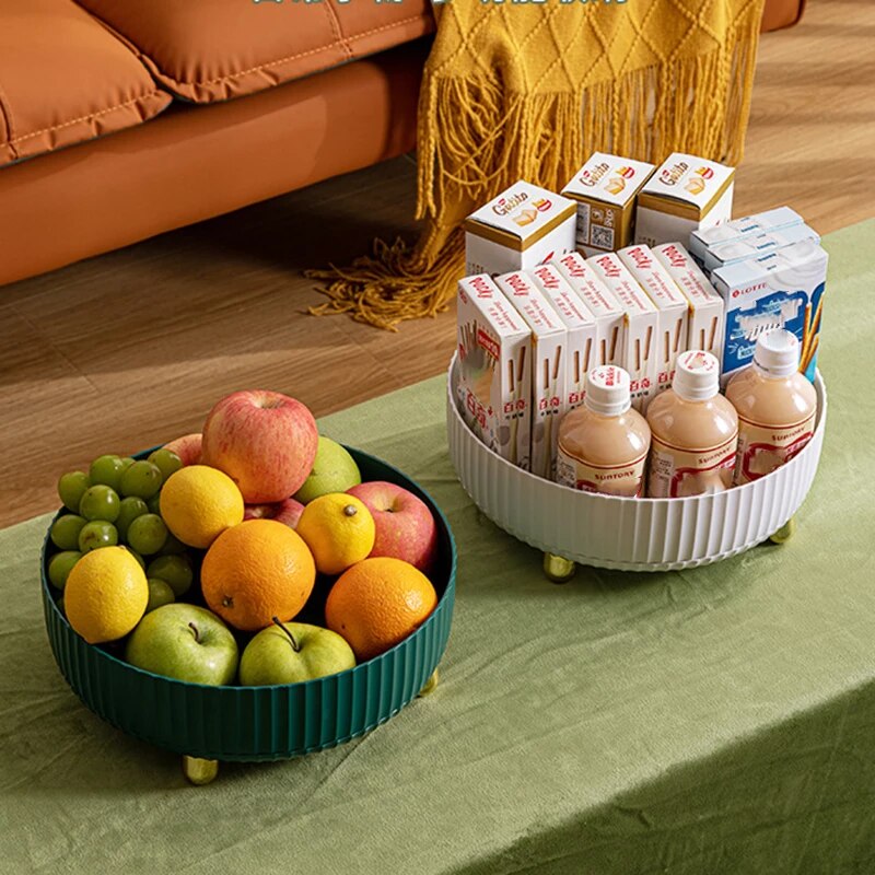 A Multi-Purpose 360° Rotating Storage Tray With fruit and juice on a table