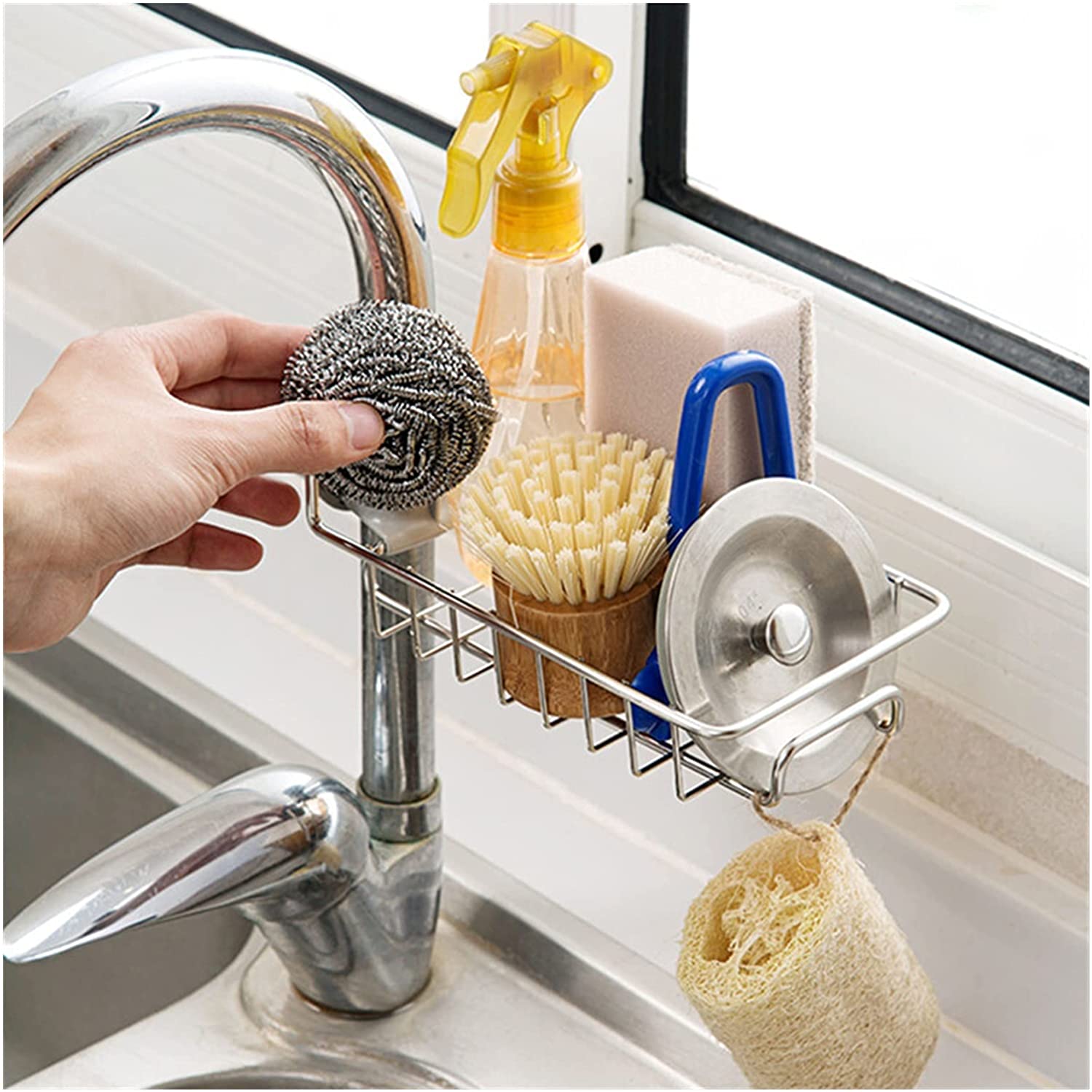 Someone taking something from the Sponge Holder Sink Organizer Drainer Faucet Hanging Storage Rack