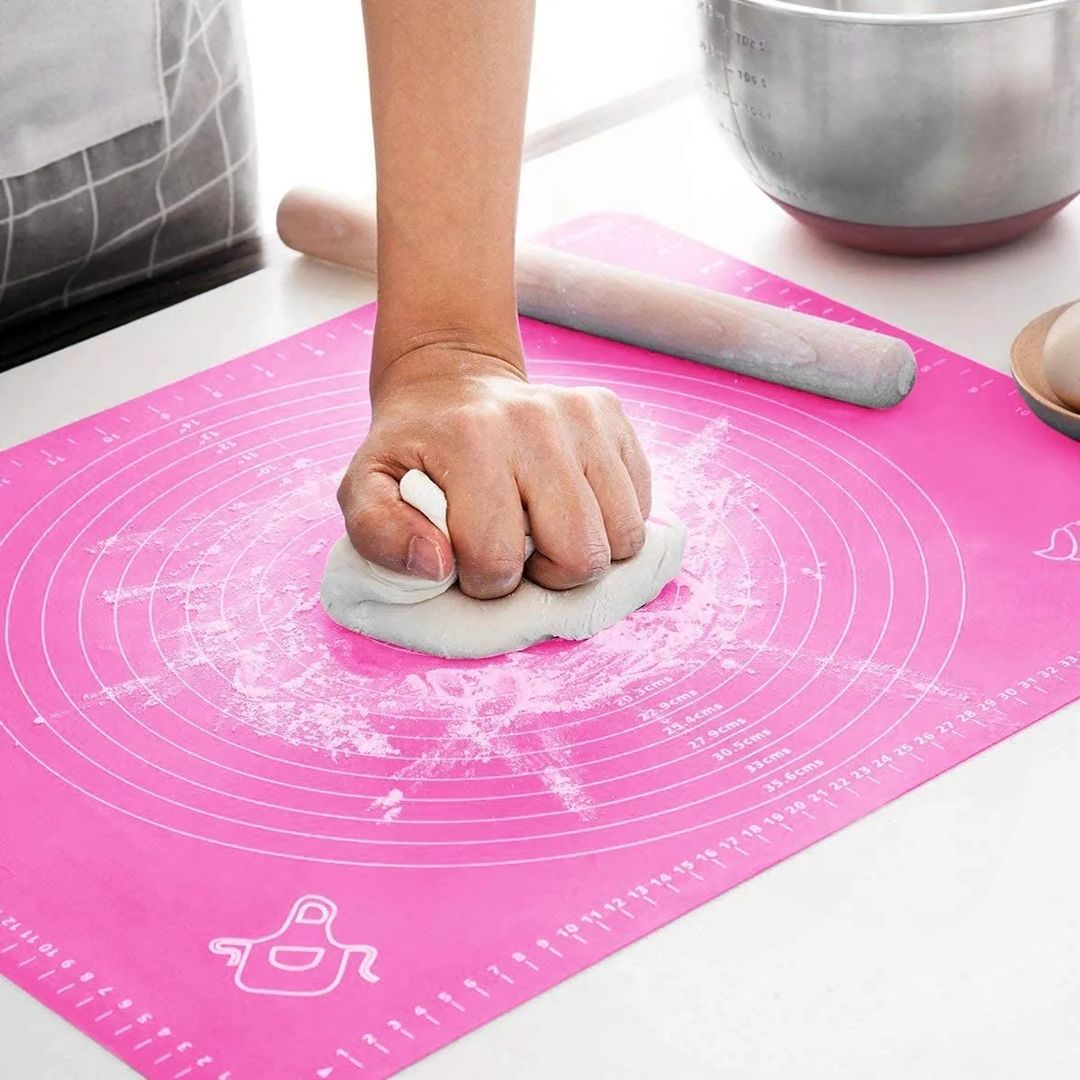 Someone making food with the help of a Non-stick Silicone Dough Mat