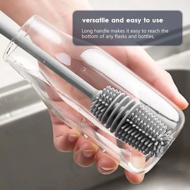 Someone cleaning a bottle with the help of a Silicone Corner Brush for bottles