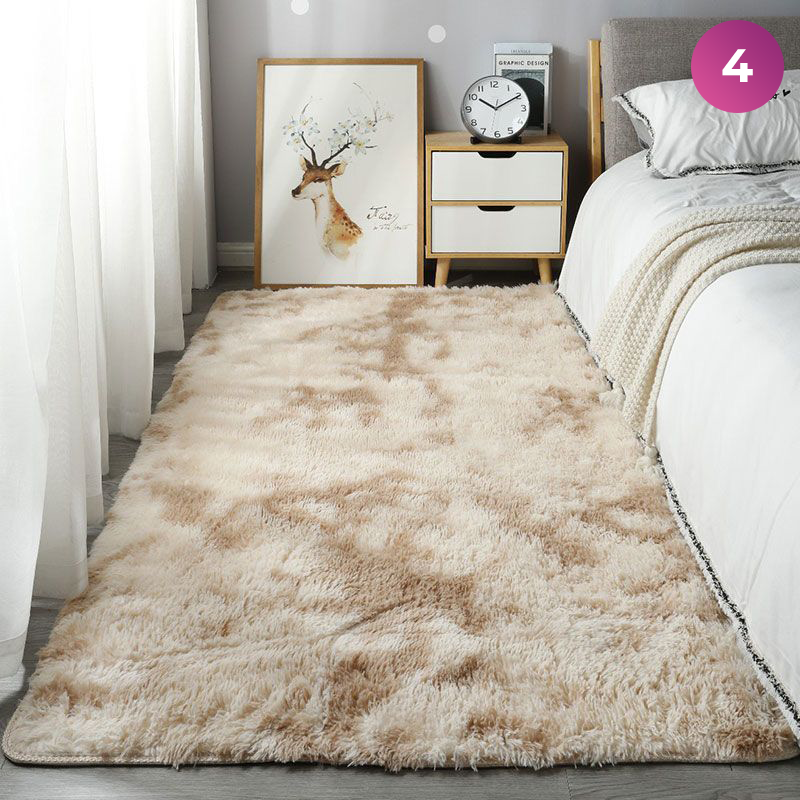 An Ultra Soft Indoor Rug is placed in a room next to the bed