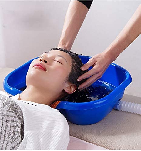 Someone washing his hair with the help of a Portable Hair Wash Basin Tub