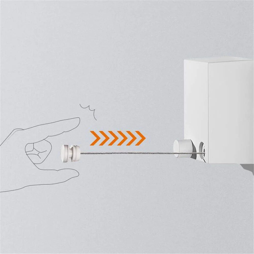 a hand holding a wire of a Retractable Wire Indoor and Outdoor Clothes Wall Hanger