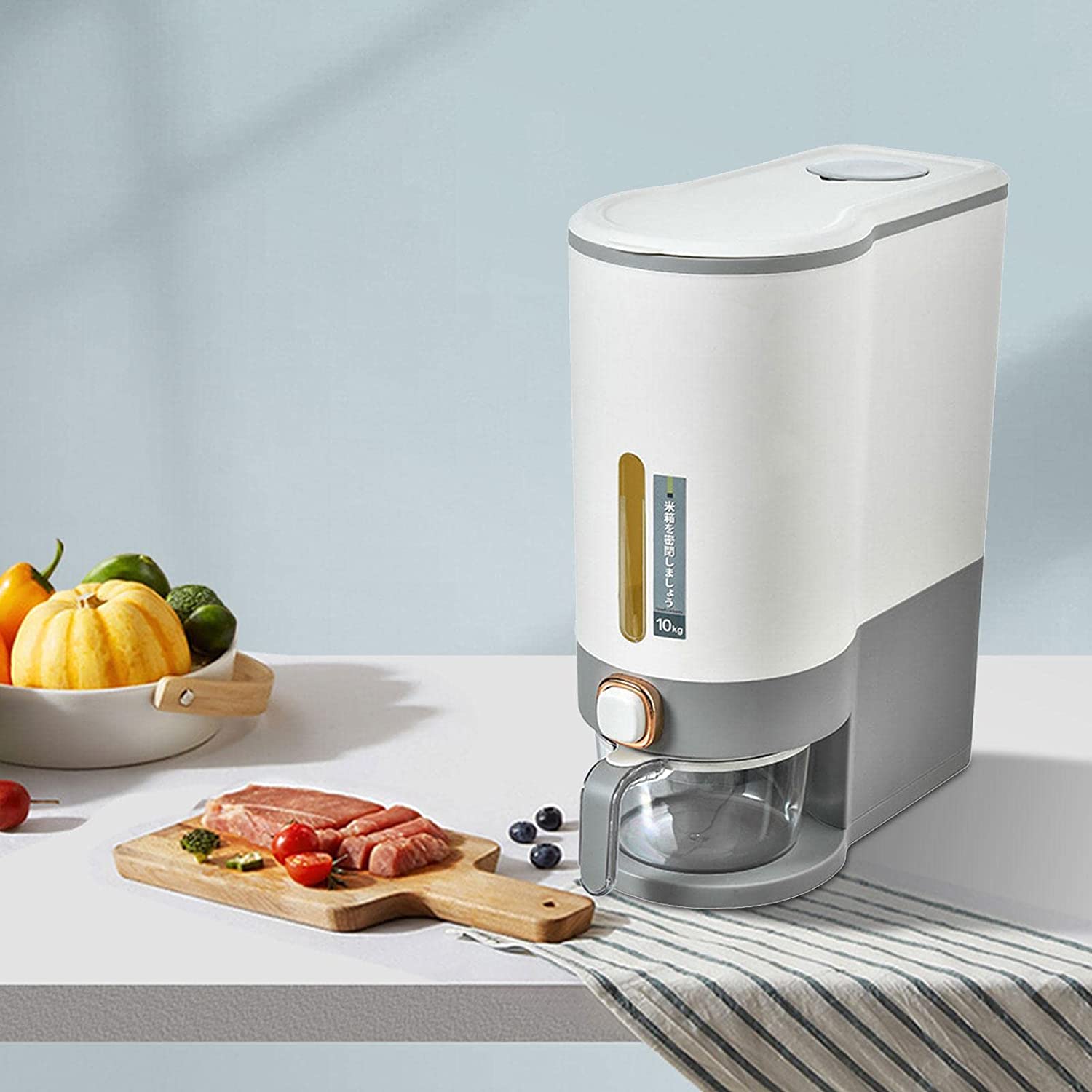 10 kg Single Grind Rice and Grain Dispenser placed next to some items