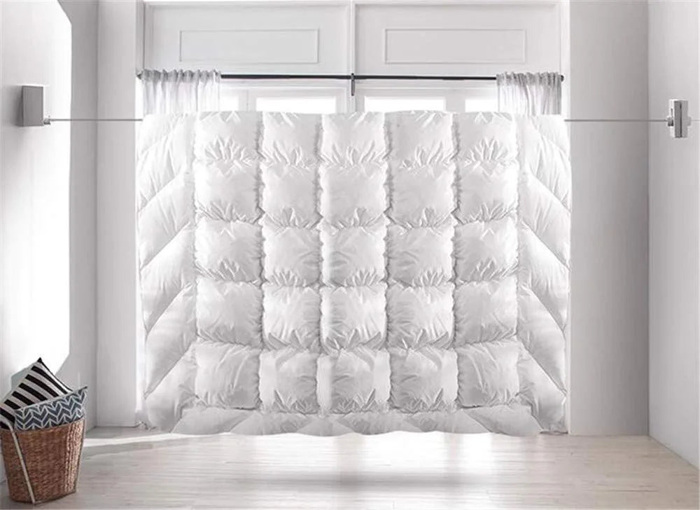 a white blanket hanged in Retractable Wire Indoor and Outdoor Clothes Wall Hanger