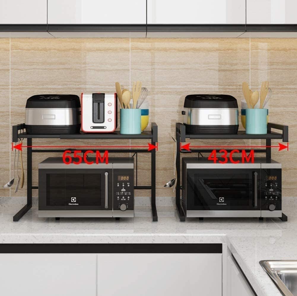Tow microwave oven with an adjustable carbon steel rack and various utensils neatly arranged inside