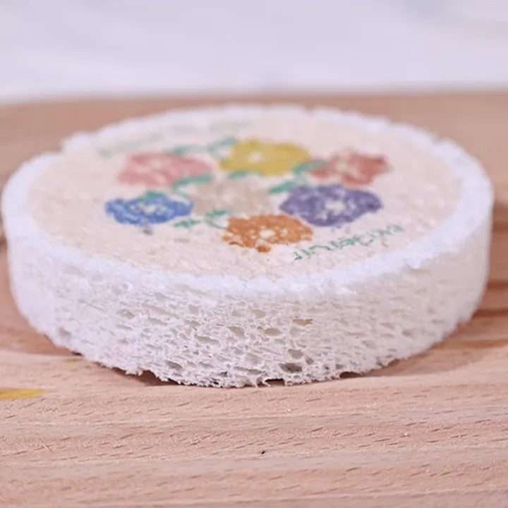 The Kitchen Cleaning Non-stick Wood Pulp Sponge Wipe is placed on the floor