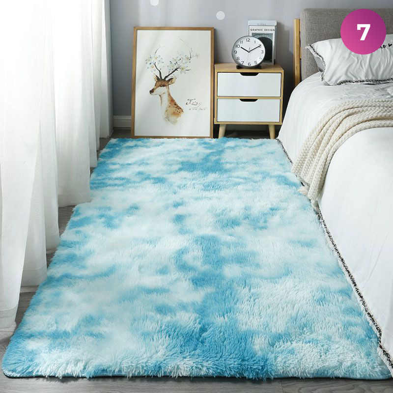 An Ultra Soft Indoor Rug is placed in a room next to the bed