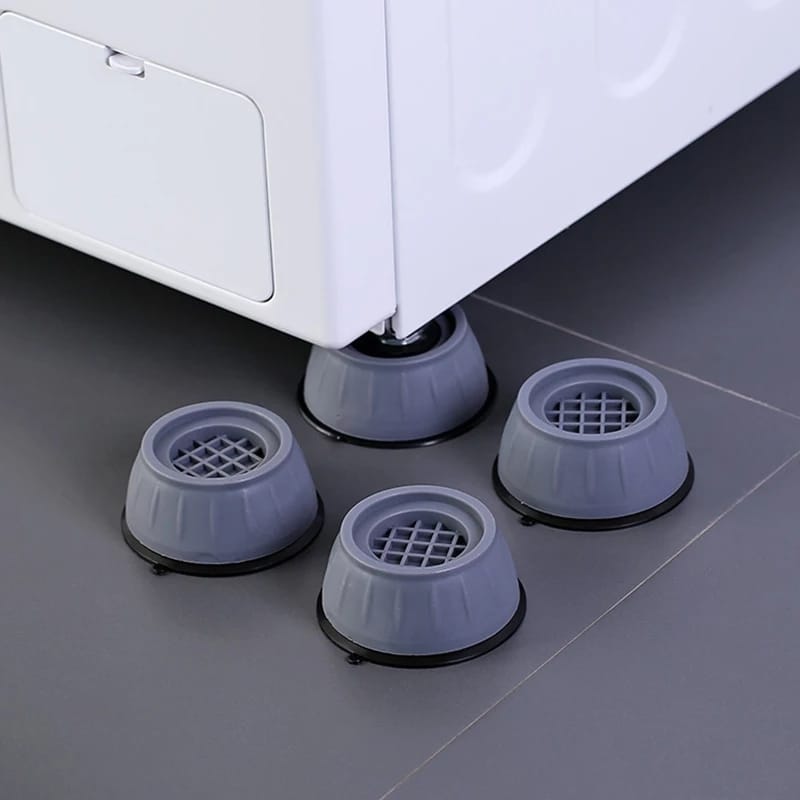 Image displaying four Washing Machine Foot Pads,one installed on a washing machine and the other three kept beside of it