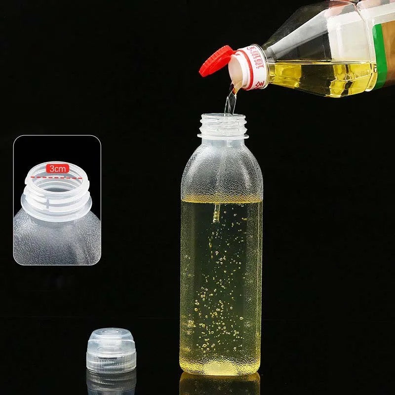 Someone is pouring oil into a Kitchen Oil Spray Injection Press Bottle Sprayer Dispenser