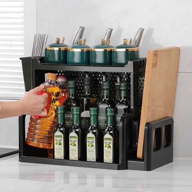 Someone is putting a bottle into the Double Layer Spices Organizer Storage Rack