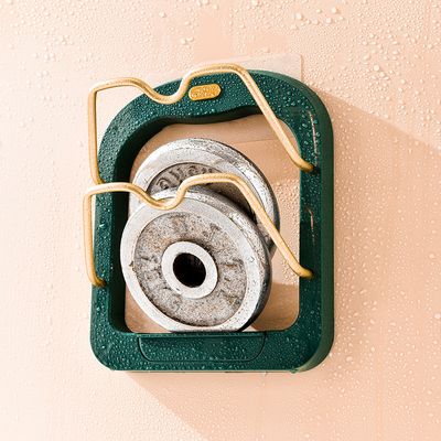 The Useful Kitchen 2 Tier Pot Lid Pan Holder Shelf is placed on the wall