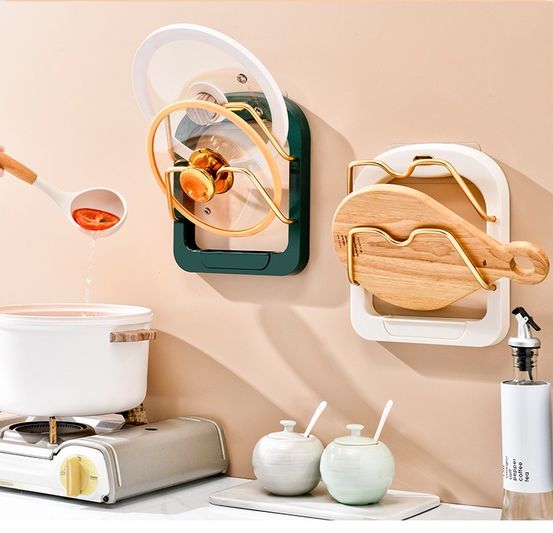 The Useful Kitchen 2 Tier Pot Lid Pan Holder Shelf is placed on the wall next to some items