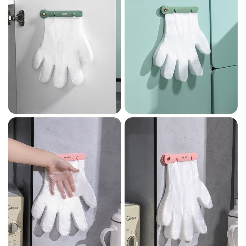 Disposable hand gloves with a wall mount clip organizer are placed on the wall