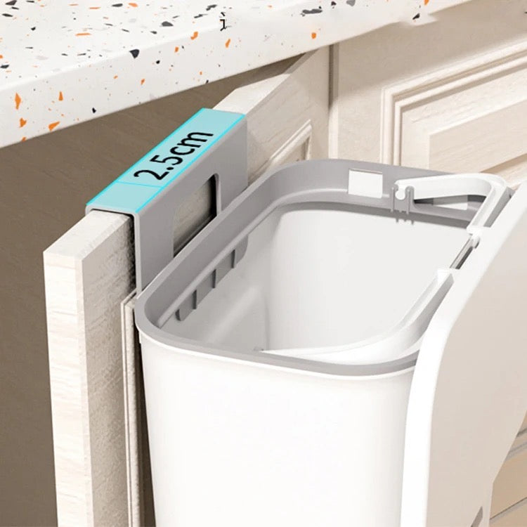A close-up view of the 9L Trash Can Wall Mounted Hanging Bin for Kitchen Cabinet Door with a lid