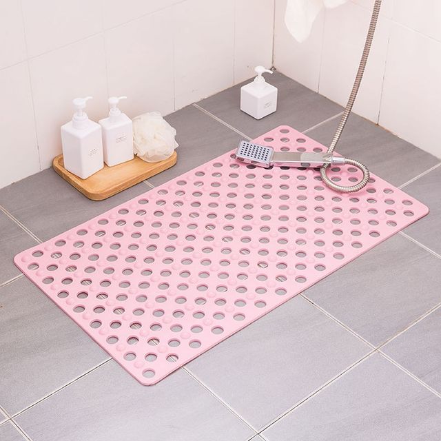 Non-slip extra-long bathroom shower mat placed in the bathroom