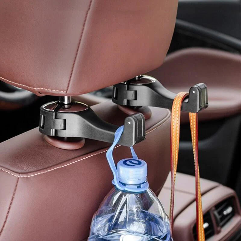 bottles hanging on the Car Headrest Hook Handbag Storage Holder