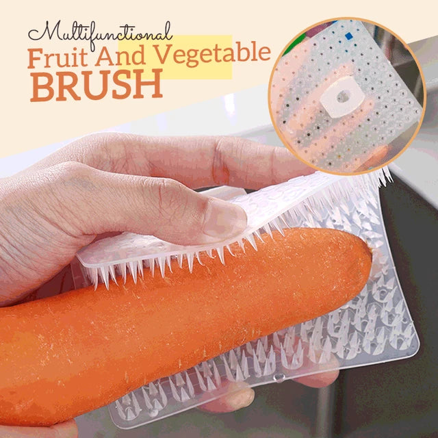 Someone rubbing a carrot with the help of a Multifunctional Fruit Vegetable Rubbing Brush