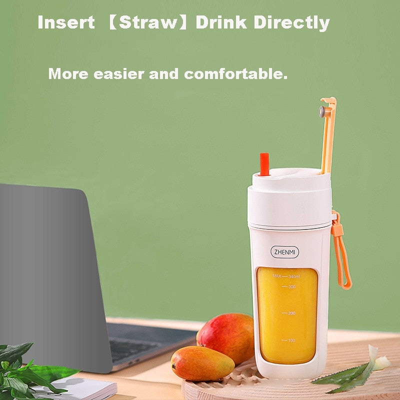 340ml Portable USB Rechargeable 8 Blades Stainless Steel Blender placed next to a laptop