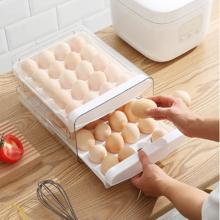 Someone taking eggs from the Double Layer Egg Storage Drawer