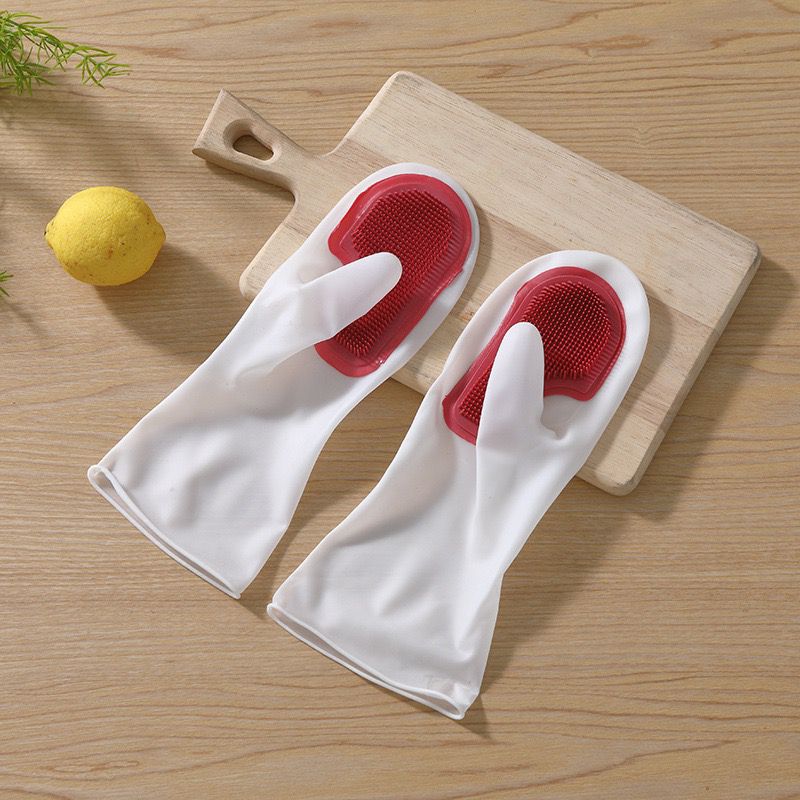 1 pair of silicone gloves for dishwashing placed on the wood in red color
