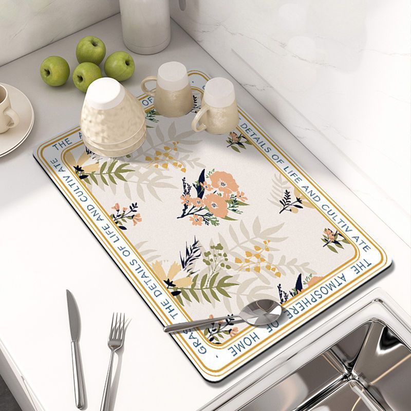 Showcasing Dish Drying Mat with spoon and mugs kept on a kitchen counter top