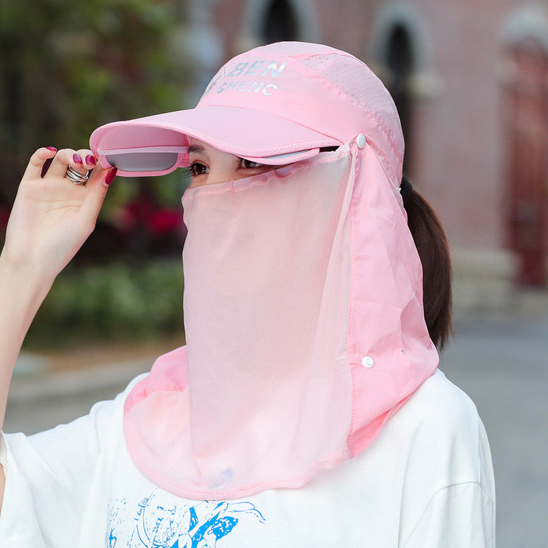A Woman is Wearing Wide Brim Bucket Hat with Neck Cover.